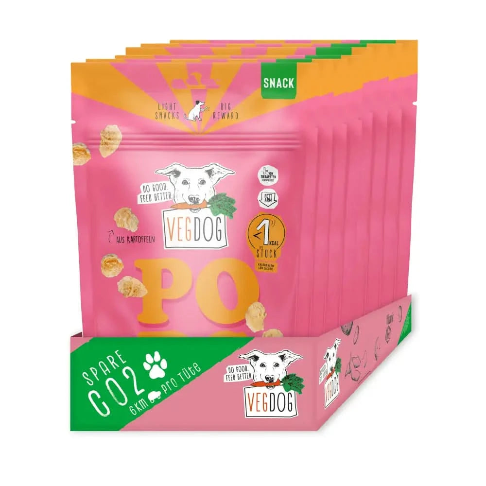 Pink und orange verpackte vegdog snacks pops 20 g im retail display für hund mit hundespielzeug und hundehalsband