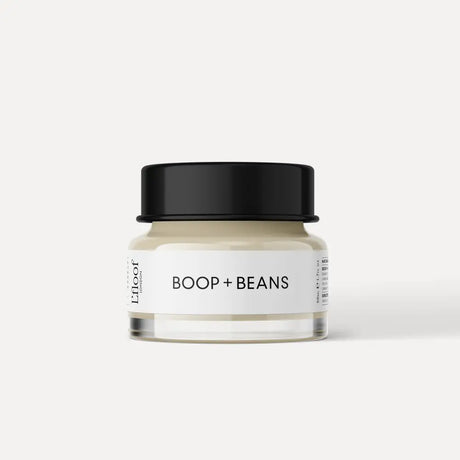 Ein minimalistisches glas mit schwarzem deckel und weißem etikett von boop + beans für l’floof nasen- mit natürlicher formel und aloe vera