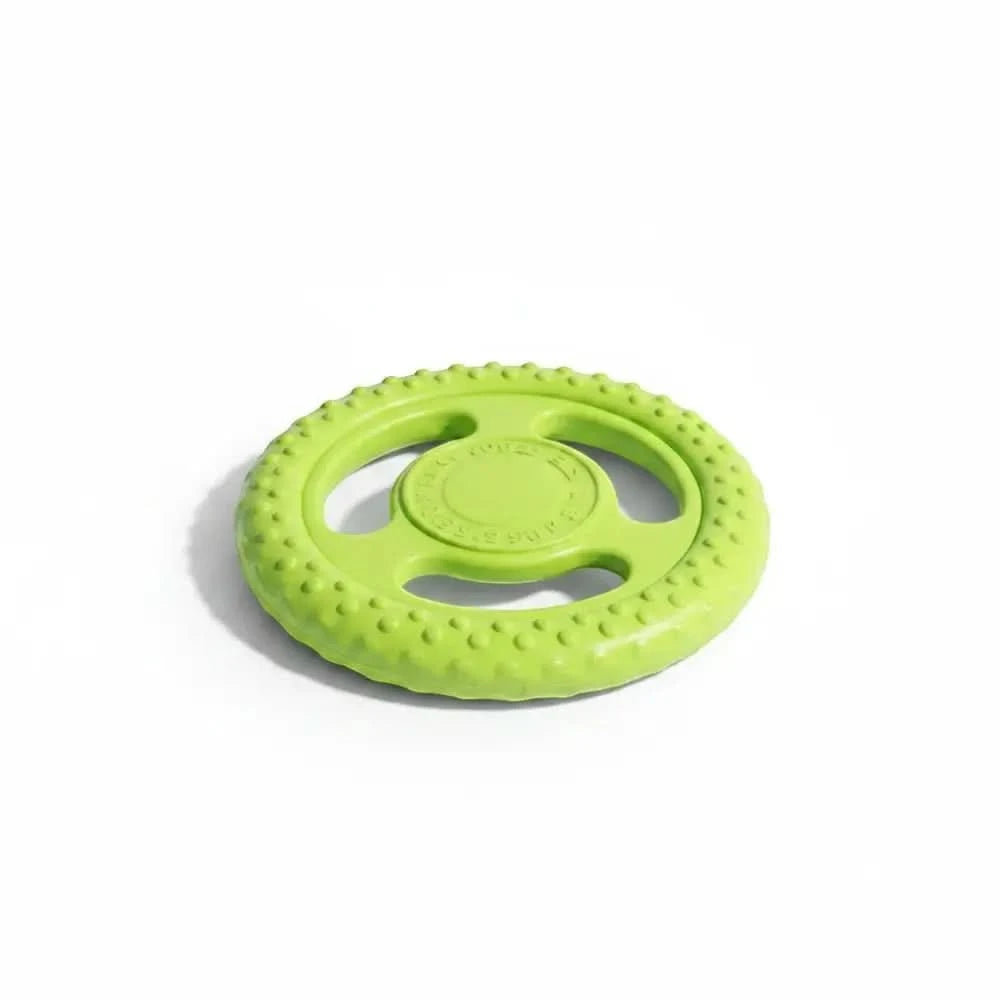 Hellgrünes, strukturiertes gummispielzeug in lenkradform als kiwi walker dog disc frisbee robust und langlebig