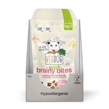 A package of vegdog puppy brainy bites hypoallergen hundesnacks with white green design and dog holding carrot