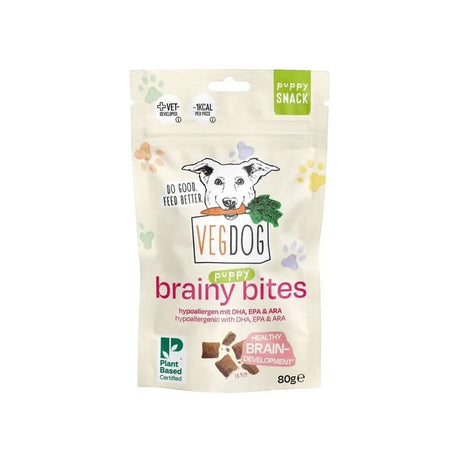 A weißer wiederverschließbarer beutel vegdog puppy brainy bites mit cartoon welpe und karotte auf der vorderseite